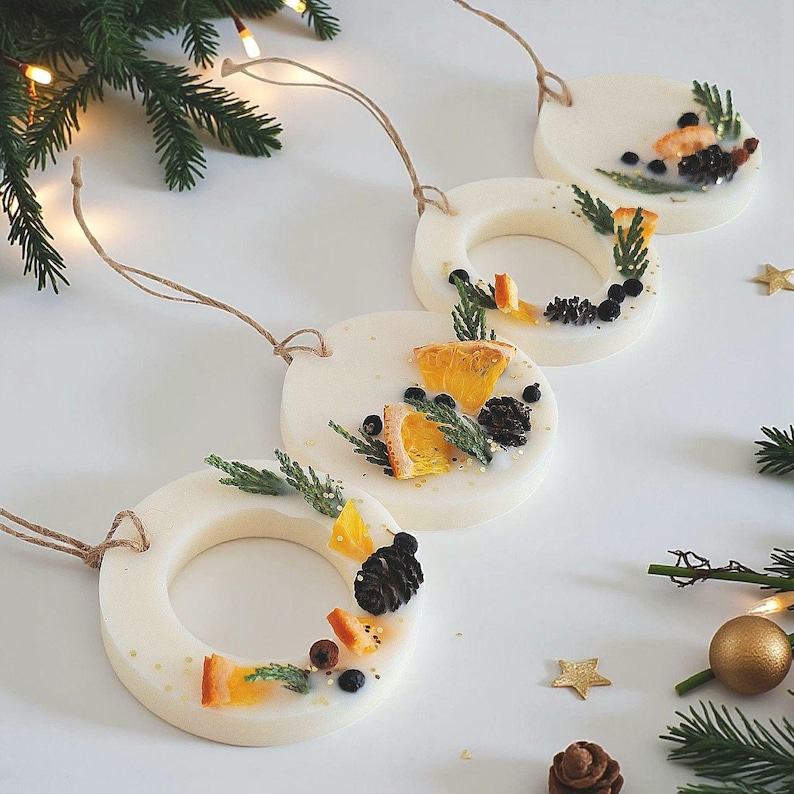 Scented hanging ornaments for tree and wardrobe, festive wax sachet decor handcrafted with natural ingredients.