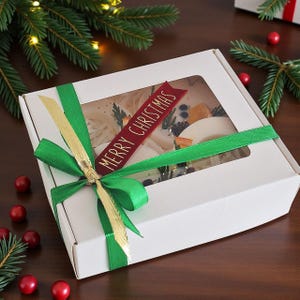 Natural handmade wax sachets with dried fruits and botanicals, perfect eco friendly Christmas decoration idea.