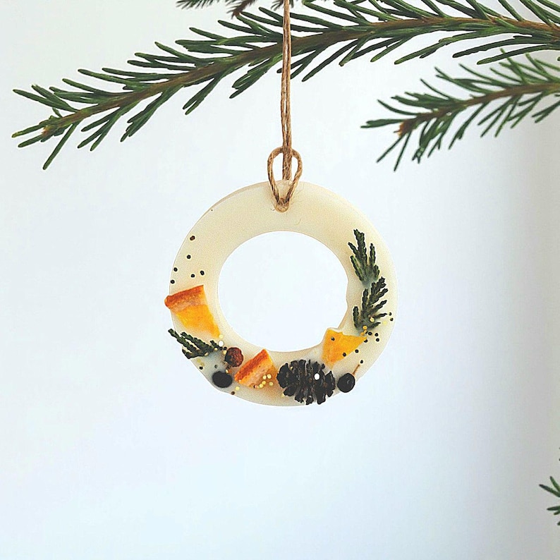 Scented hanging ornaments for tree and wardrobe, festive wax sachet decor handcrafted with natural ingredients.