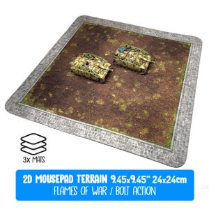 May include: A 2D mousepad terrain mat for tabletop gaming, featuring a cobblestone border and a brown and green battlefield design. Two miniature tanks are positioned on the mat. The text on the mat reads "2D MOUSEPAD TERRAIN 9.45x9.45" 24x24cm FLAMES OF WAR / BOLT ACTION."
