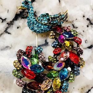 Elegant Heidi Daus large Vibrant colored Crystal Peacock brooch