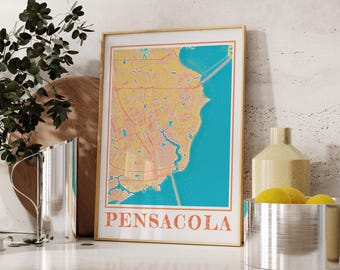 May include: A framed print of a map of Pensacola, Florida. The map is in a vintage style with a yellow and orange color scheme. The city name is printed in large, bold letters at the bottom of the map.