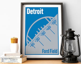 May include: A blue and gray poster with the text "Detroit" and "Ford Field". The poster features a stylized illustration of a stadium arch with a ruler-like design.