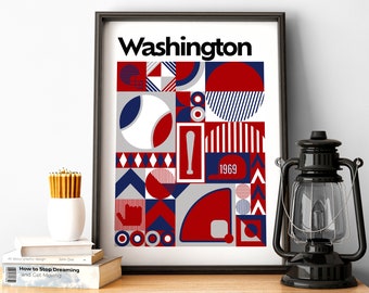 Puede incluir: Una impresión enmarcada con un diseño geométrico en rojo, blanco y azul. La impresión presenta la palabra "Washington" y el año "1969".