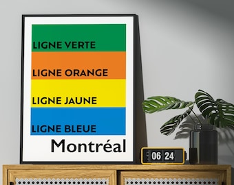 May include: A framed print with a white background and black text. The text reads "LIGNE VERTE", "LIGNE ORANGE", "LIGNE JAUNE", "LIGNE BLEUE", and "Montréal". The background is divided into four horizontal stripes of green, orange, yellow, and blue.
