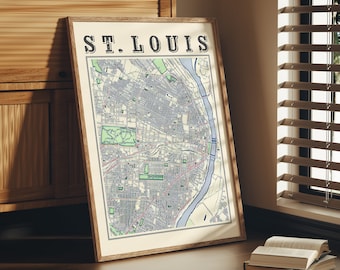 May include: A framed map of St. Louis, Missouri, with a white background and blue and green lines depicting streets and waterways. The title "ST. LOUIS" is printed in black at the top of the map.