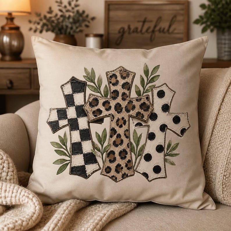 Digital sublimation instant download of A square throw pillow in a light beige fabric featuring a central graphic of three crosses. The left cross has a black and white checkerboard pattern, the center cross has a brown leopard print, and the right cross has black polka dots. PNG transfer file.