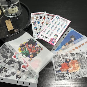 May include: A collection of Dragon Ball Z themed stickers and binder sheets. The stickers feature various characters in action poses. The binder sheets display comic book panels and character illustrations. The color palette includes vibrant oranges, blues, and greens.