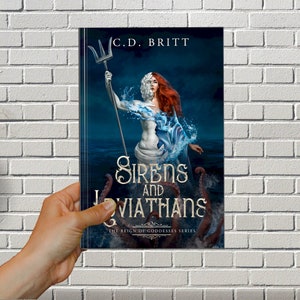 May include: Book cover featuring a woman with a half-human, half-stone face holding a trident. The woman is surrounded by water and a large octopus. The title of the book is "Sirens and Leviathans" and the subtitle is "The Reign of Goddesses Series".