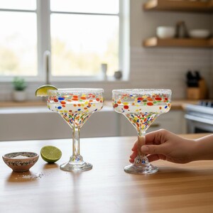 The Talavera Hub hand-blown clear glass margarita glasses with colorful confetti speckle design. Lead-free glass.