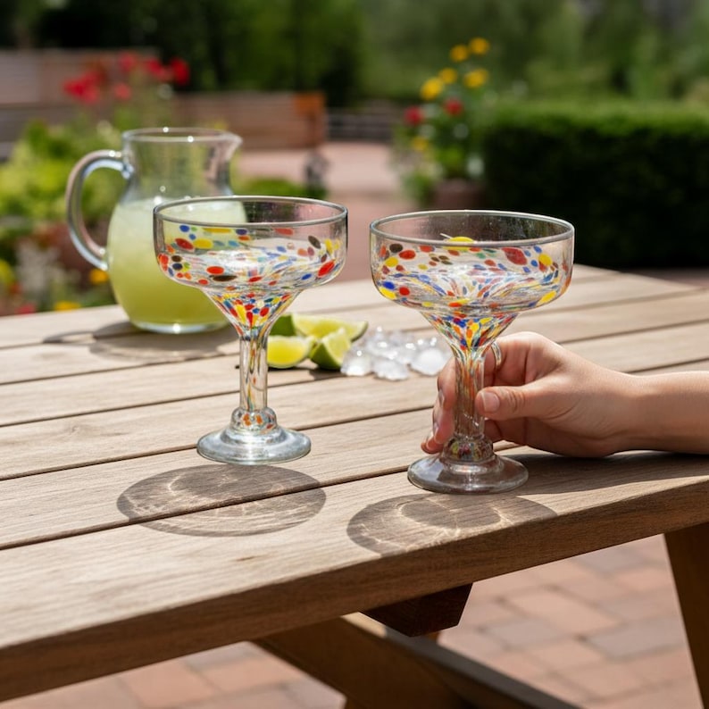 The Talavera Hub hand-blown glass margarita glass with colorful confetti speckle design.