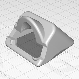 Könnte beinhalten: Ein graues, 3D-gedrucktes Objekt aus Kunststoff mit einer gewölbten Oberseite und einem kleinen Loch an der Seite.