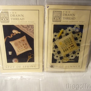 May include: Two cross stitch patterns from The Drawn Thread, charted needlework designs. The patterns are called "Spot of Spring" and "Spot of Summer".