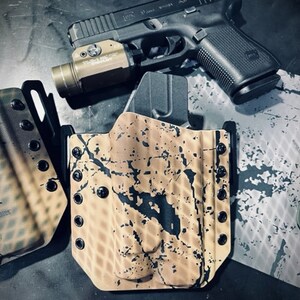 FITS: Glock 17/19/19x/44/45/47/22/23/31/32/34/35 - Stream light TLR1/HL  OWB Holster Operator Series