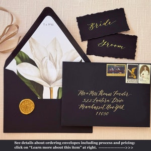May include: Black and white wedding invitation envelope with a gold wax seal. The envelope is addressed to Mr. & Mrs. Thomas Fender, 522 Lantern Drive, Manhasset, New York 11050.