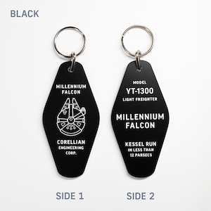 May include: Black metal keychain shaped like a motel key with a white outline of the Millennium Falcon spaceship. The front side says "Millennium Falcon" and "Corellian Engineering Corp." The back side says "Model YT-1300 Light Freighter", "Millennium Falcon", and "Kessel Run in less than 12 parsecs".