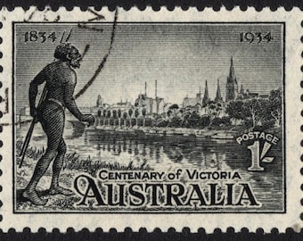 May include: Black and white postage stamp commemorating the Centenary of Victoria, Australia. Features an illustration of an Indigenous person with a spear, a cityscape, and the text "Centenary of Victoria AUSTRALIA". The stamp is dated 1834 and 1934.