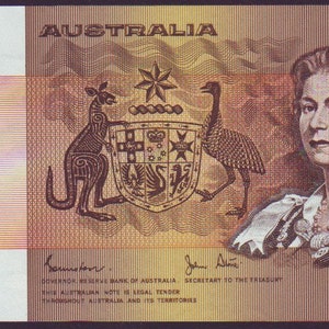 May include: A one Australian dollar note featuring a portrait of Queen Elizabeth II, a kangaroo, an emu, and the Australian coat of arms. The note is yellow and brown with a red and white stripe pattern. The text "ONE DOLLAR" is printed vertically on the left side of the note. The text "AUSTRALIA" is printed in large letters at the top of the note. The text "DNX 588192" is printed in the bottom left and right corners of the note.