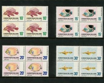 May include: A sheet of 12 colorful stamps featuring various fish species from Christmas Island. The stamps are arranged in four rows of three, with each stamp depicting a different fish. The stamps are all in mint condition and have never been used.