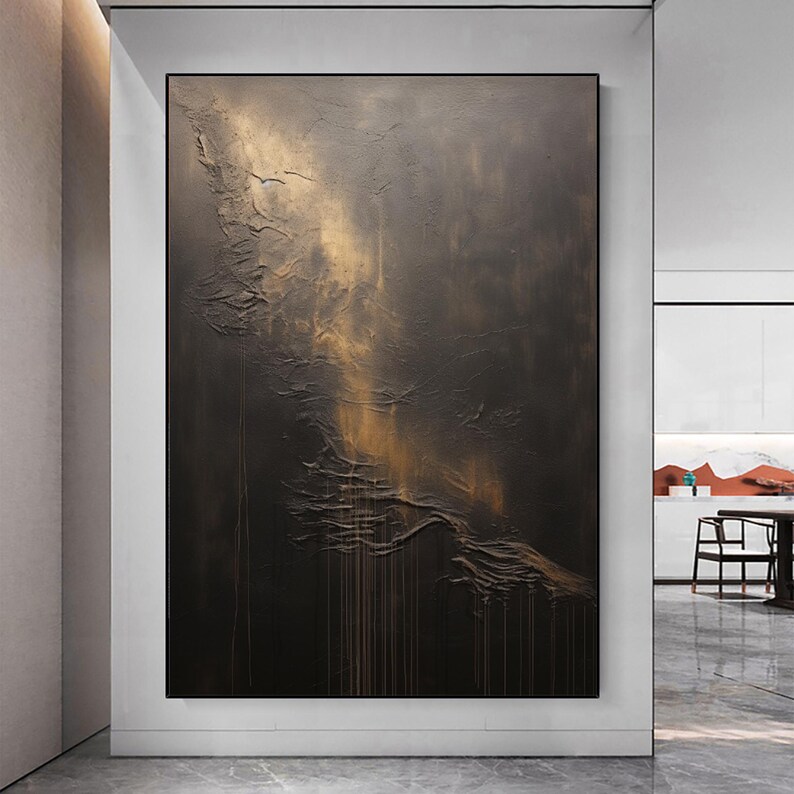 May include: Abstract painting with a textured, dark brown background and gold accents. The painting has a vertical orientation and a modern style.