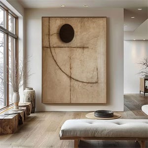 Puede incluir: Impresi&oacute;n de arte abstracto con un gran c&iacute;rculo negro y un fondo marr&oacute;n, beige y blanco. La impresi&oacute;n presenta un dise&ntilde;o geom&eacute;trico con una l&iacute;nea curva y una l&iacute;nea recta.