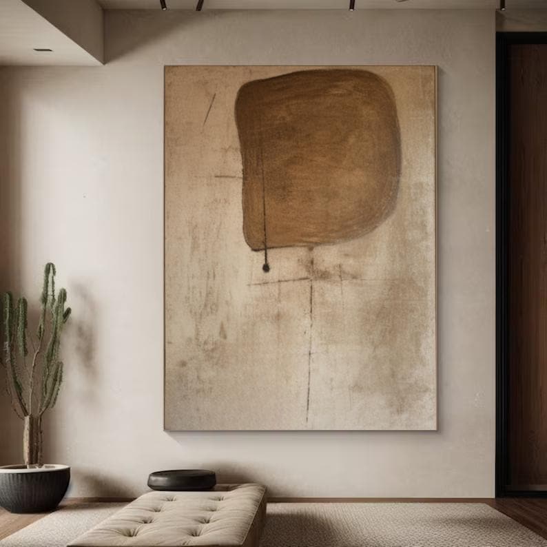 May include: Abstract painting with a large brown shape on a beige background. The shape is slightly rounded and has a rough texture. There are thin black lines throughout the painting.
