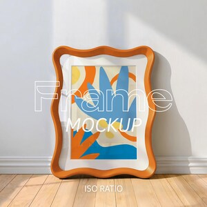 May include: An orange and white wavy-edged frame with a colorful abstract art print. The artwork features blue, orange, and yellow shapes. The words "Frame Mockup" and "ISO Ratio" are displayed on the image.