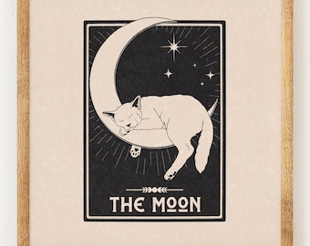 May include: A black and white illustration of a cat sleeping on a crescent moon with stars in the background. The text "THE MOON" is printed below the image.