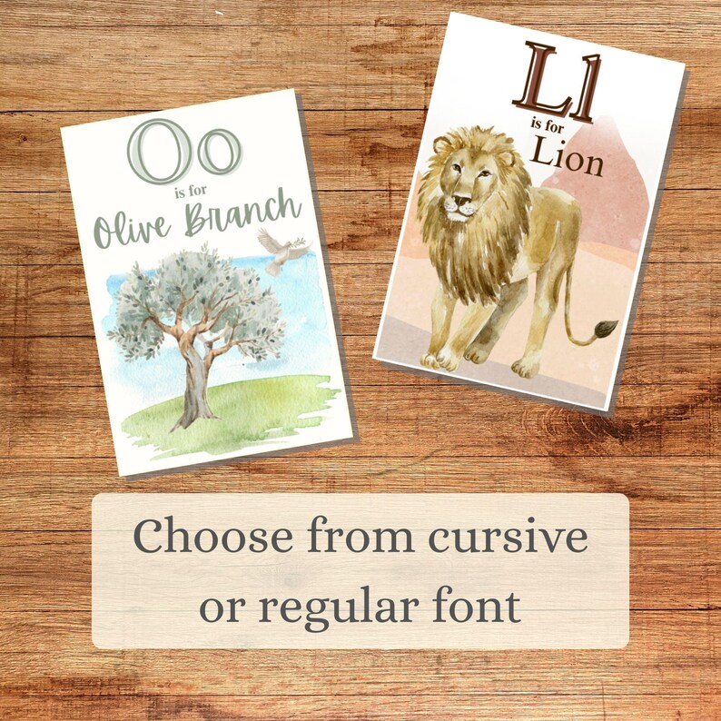 May include: Two watercolor alphabet art prints. One features the letter "O" with "Olive Branch" text and an olive tree illustration. The other shows the letter "L" with "Lion" text and a lion illustration. The text "Choose from cursive or regular font" is also present.