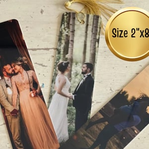 May include: Three personalized bookmarks with photos of couples. The bookmarks are 2 inches by 8 inches and have a gold tassel.