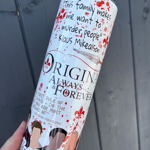 May include: White tumbler with the text "This family makes me want to murder people" and "Always & Forever". The design includes red splatter and images of characters from The Originals. The bottom of the tumbler reads "The Mikaelson".