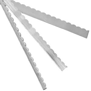 May include: Three silver cake decorating tools with scalloped edges.