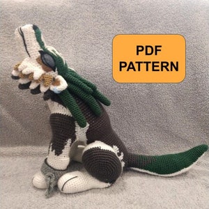 May include: Crocheted wolf plush toy made with green, brown and white yarn. The wolf is sitting with its head tilted back and its mouth open. The toy is labelled "PDF PATTERN".