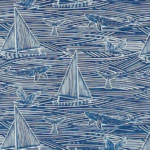 May include: A blue and white patterned fabric with a nautical theme. The pattern features sailboats, whales, seagulls, and waves. The fabric is perfect for quilting, sewing, and crafting.