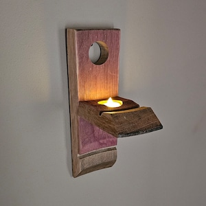 Aplique de pared con vela de té