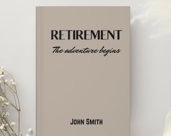 May include: A beige book with the text "RETIREMENT The adventure begins" and the name "JOHN SMITH" printed on the cover.