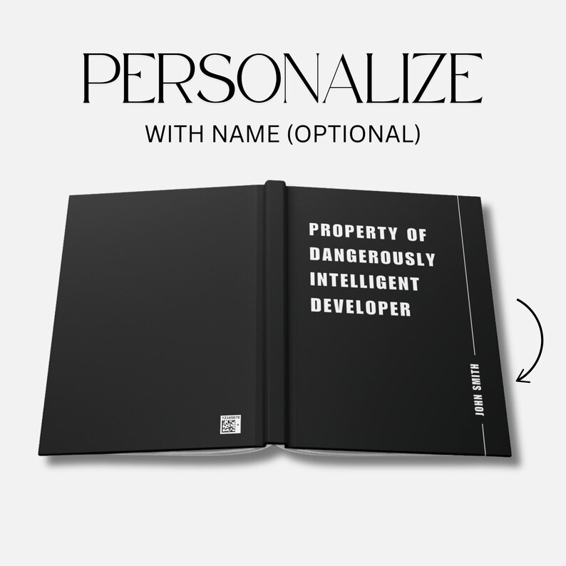 May include: Open black journal with the text "PERSONALIZE WITH NAME (OPTIONAL)" at the top. The right page reads "PROPERTY OF DANGEROUSLY INTELLIGENT DEVELOPER" with the name "JOHN SMITH" printed vertically. A QR code is visible.