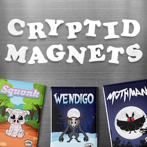 May include: White "CRYPTID MAGNETS" text above three rectangular magnets. The magnets feature illustrations of cryptids: Squonk, Wendigo, and Mothman. The Squonk magnet is green and pink, the Wendigo magnet is blue, and the Mothman magnet is dark blue.