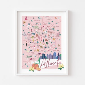 May include: A pink illustrated map of Atlanta, Georgia with landmarks and icons. The map includes the Atlanta skyline, the Georgia Aquarium, the World of Coca-Cola, and the Atlanta Botanical Garden. The text "Atlanta" is written in a white banner with a peach and magnolia flower.