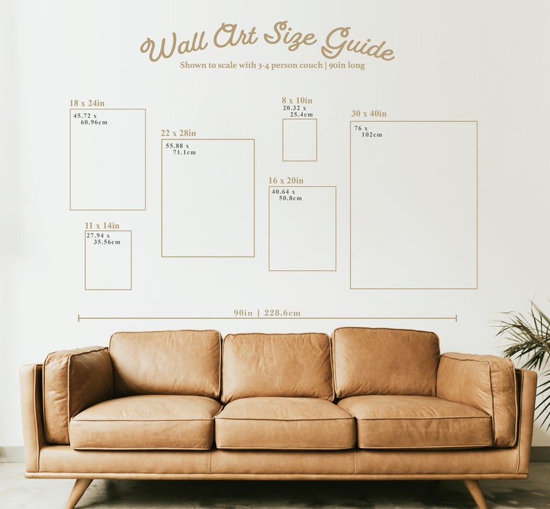 May include: A guide to wall art sizes, shown to scale with a 90-inch long couch. The guide shows different sizes of wall art, ranging from 11 x 14 inches to 30 x 40 inches, with corresponding measurements in centimeters.