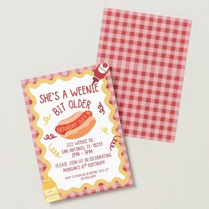 May include: A rectangular birthday invitation card featuring a red and white gingham pattern border. The centre text reads: SHE'S A WEENIE BIT OLDER, SATURDAY JULY 18, 222 WEENIE RD. SAN ANTONIO, TX 78233 2PM-5PM, PLEASE JOIN US IN CELEBRATING MORGAN'S 10TH BIRTHDAY.