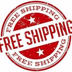 May include: Red circular stamp with the text "FREE SHIPPING" in white lettering. The stamp has a distressed, worn look and two white stars.