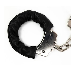 Genuine leather wrist protector for handcuffs