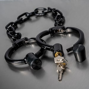 Very heavy leg irons with large chain in black