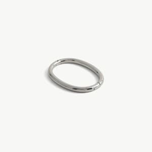 May include: A polished silver-tone metal oval carabiner ring with a smooth, continuous surface. The hardware features a hinged opening mechanism on one side, allowing the ring to be opened and closed securely for attaching various items or accessories.