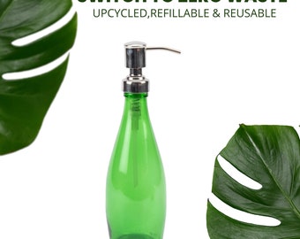 May include: Green glass bottle with a silver pump dispenser. The bottle is labelled "Switch to Zero Waste Upcycled, Refillable & Reusable".