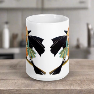 This ceramic coffee mug features a vintage deco illustration of a cute flapper witch flying on a broom with an orange full moon behind her.