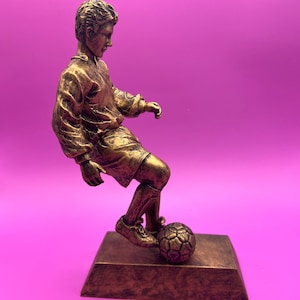 Gold Male Dribbling Soccer Trophy