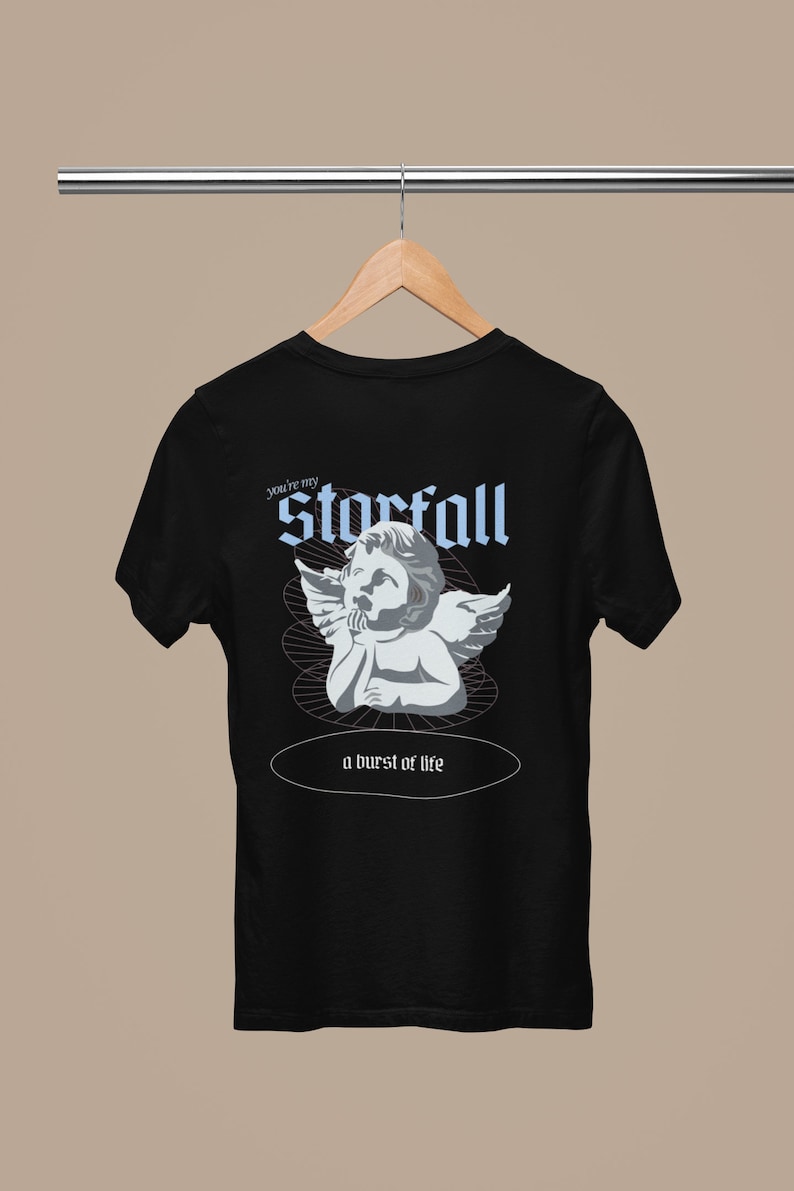 May include: Black t-shirt with a graphic of a cherub angel with wings and the text "you're my starfall a burst of life".
