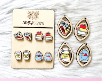 May include: A set of laser cut wooden earrings featuring various school-themed designs, including a coffee cup with the text "Teacher Fuel", a backpack, books, and crayons. The earrings are displayed on a wooden board with the text "ShelbyDESIGNING".